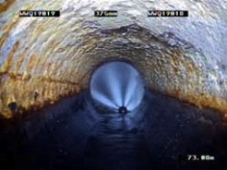 CCTV view of a jetting nozzle clearing a pipe